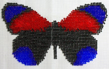Borduurpakket vlinder zwart/blauw/rood 10x16cm.