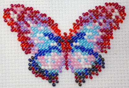 Vlinder multicolor 6x8 cm.