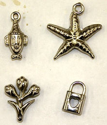 Metallook bedels div vormen 4stuks. zilverkl.