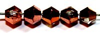 Facetkraal 4mm konisch transparant/caprigold 50st.