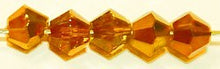 Facetkraal 4mm konisch d.geel goud gecoat 50st.