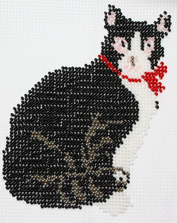 Borduurpakket zwarte kater met strik.16x11cm.