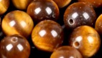 Edelsteen 6mm Tijgeroog yellow ca 60st..