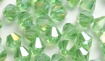 Facetkraal 4mm bicone tr.groen AB 50st.